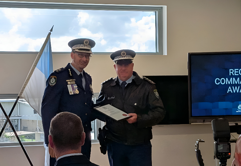 RPD Superintendent Andrew Spliet presents Sergeant Steven Magnone with the District Commander's Commendation. 